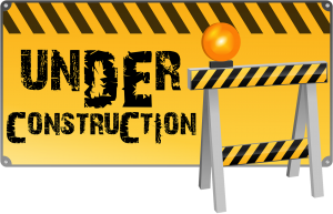 Under Construction Sign with Black and Yellow Hazard Colours